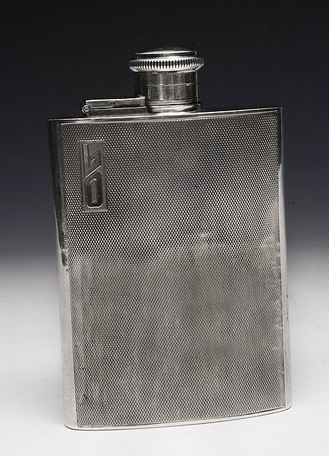 Appraisal: A WWII PERIOD ENGINE TURNED SILVER HIP FLASK inscribed Louis