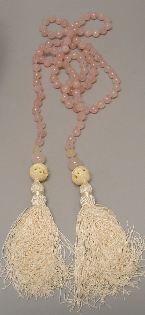 Appraisal: Rose quartz beaded sash with ivory puzzle ball terminations and