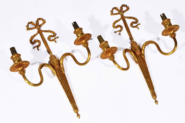 Appraisal: A PAIR OF GILT METAL TWO BRANCH WALL LIGHTS with