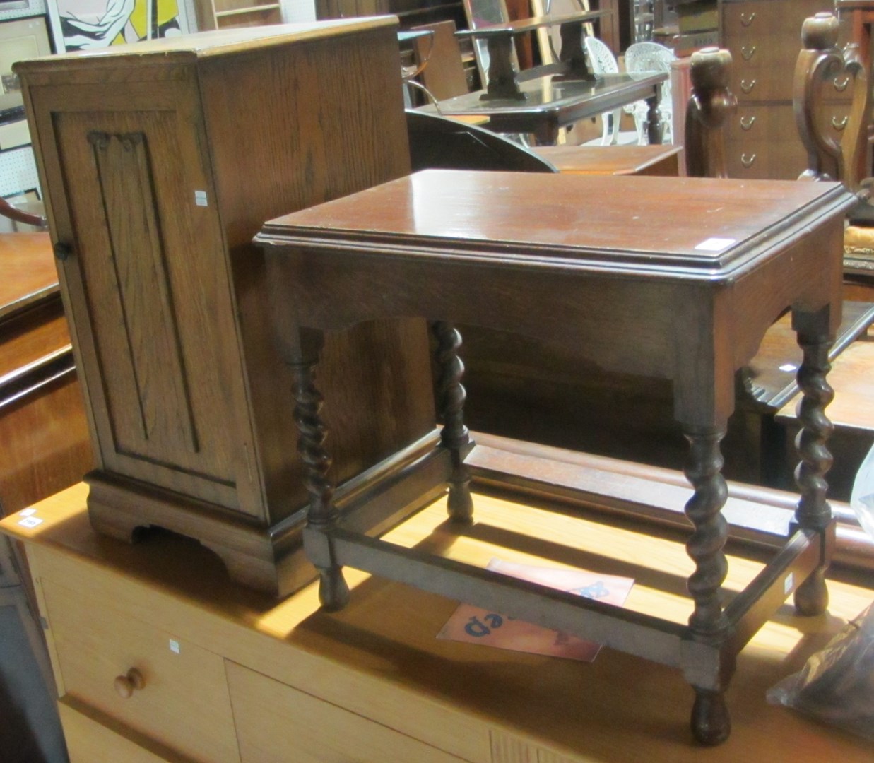 Appraisal: An oak pot cupboard and a mahogany occasional table