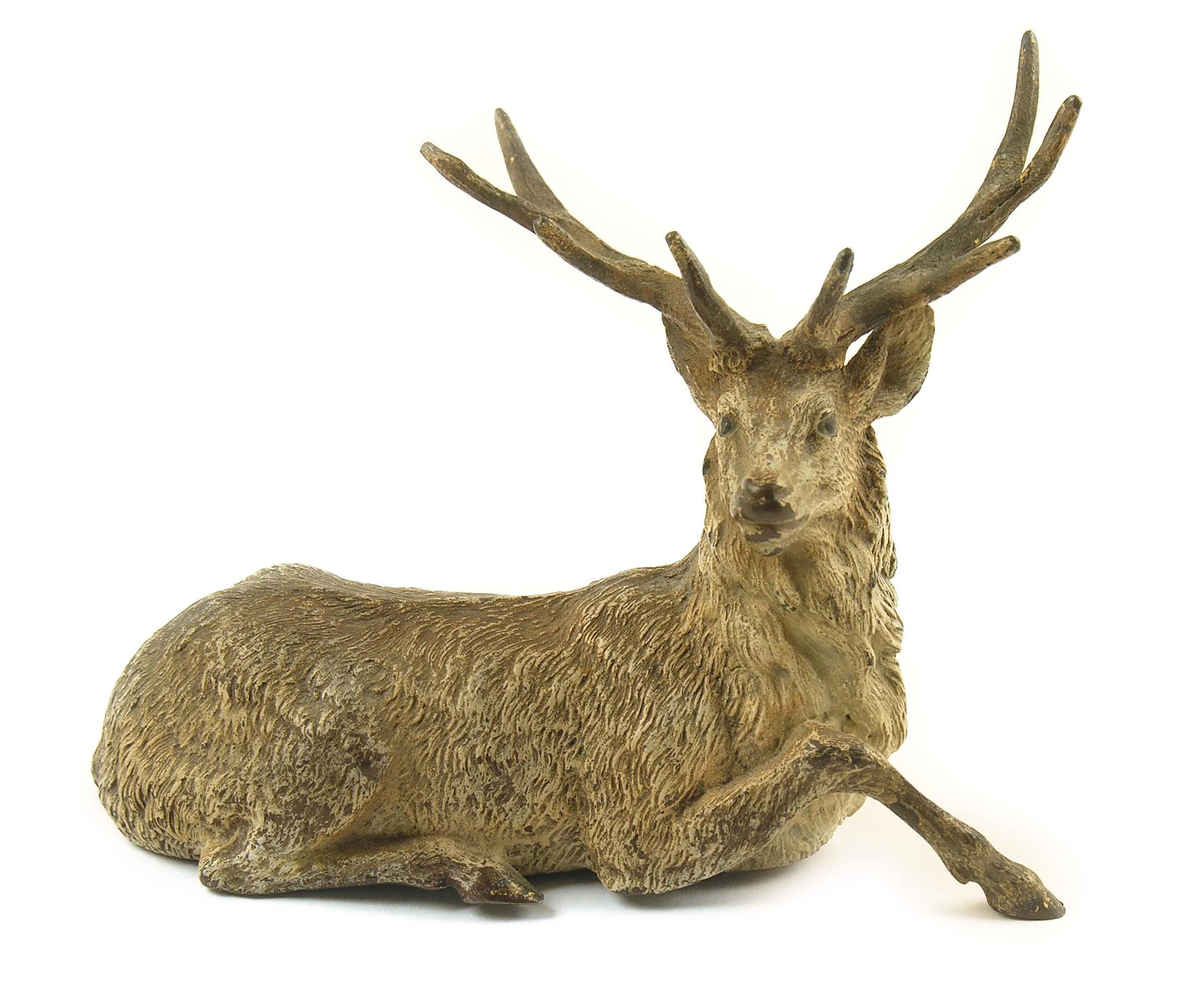 Appraisal: A th century cold painted bronze of a recumbent stag