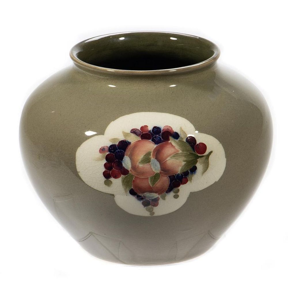 Appraisal: Moorcroft Pottery Vase Decorated with berries and fruit in a