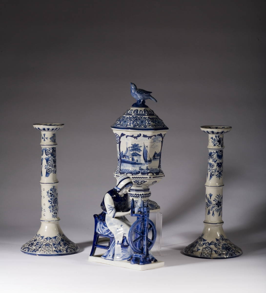 Appraisal: DUTCH DELFT FIGURE OF A WOMAN SEATED AT A SPINNING