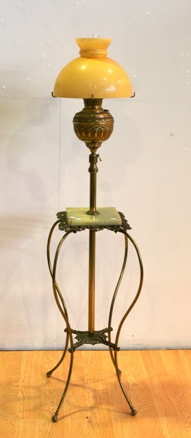 Appraisal: A late th century French brass and onyx standard lamp