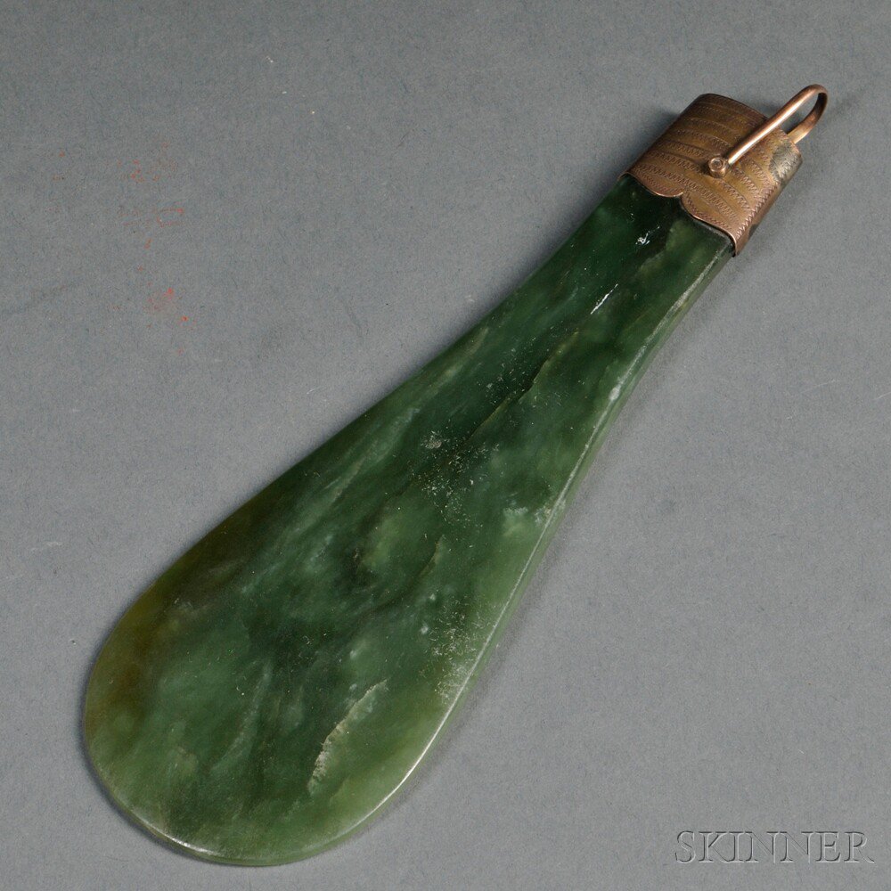 Appraisal: Spinach Green Stone Shoehorn China typical form with metal mount