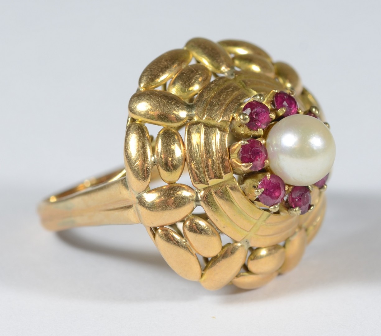 Appraisal: K YG dome ring w pearl red stones size dwt