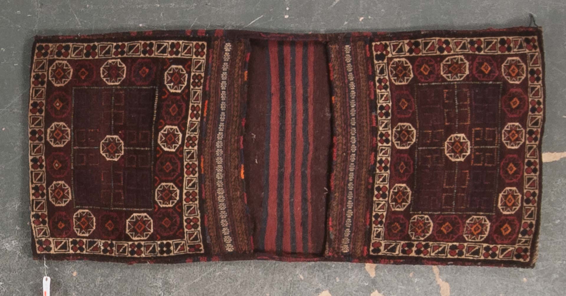 Appraisal: Semi-antique Belouch saddle bag approx x Afghanistan circa Condition Excellent