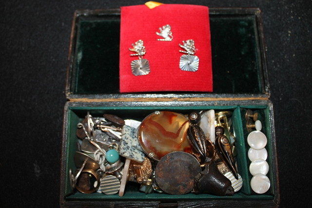 Appraisal: A SMALL LEATHER JEWELLERY BOX containing assorted cufflinks earrings an