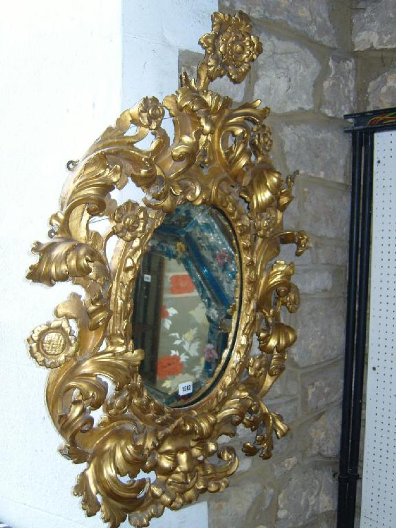 Appraisal: A good Florentine carved pine wall mirror the mirror plate