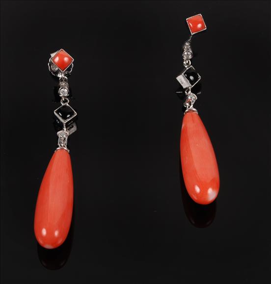 Appraisal: A pair of coral onyx and diamond earrings each suspending