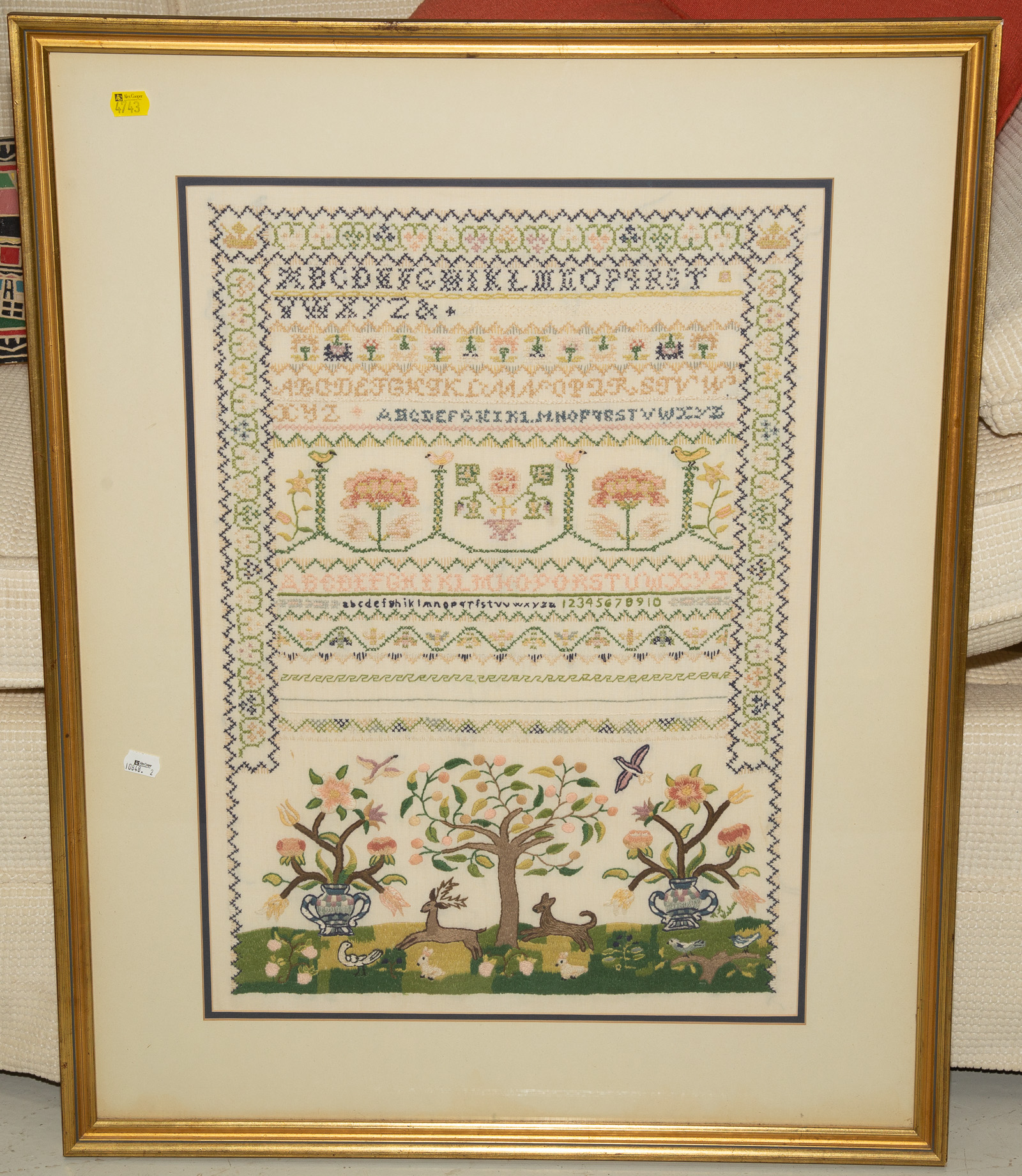 Appraisal: FRAMED EMBROIDERED ALPHABET THEMED ARTWORK Sight size x in