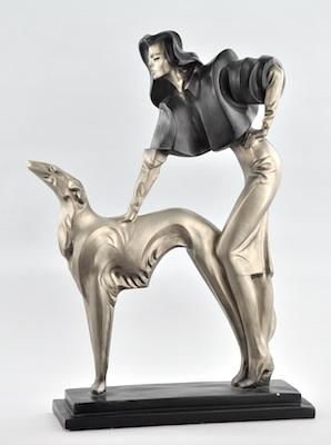 Appraisal: A Cast Metal Sculpture of a Woman and Greyhound Austin