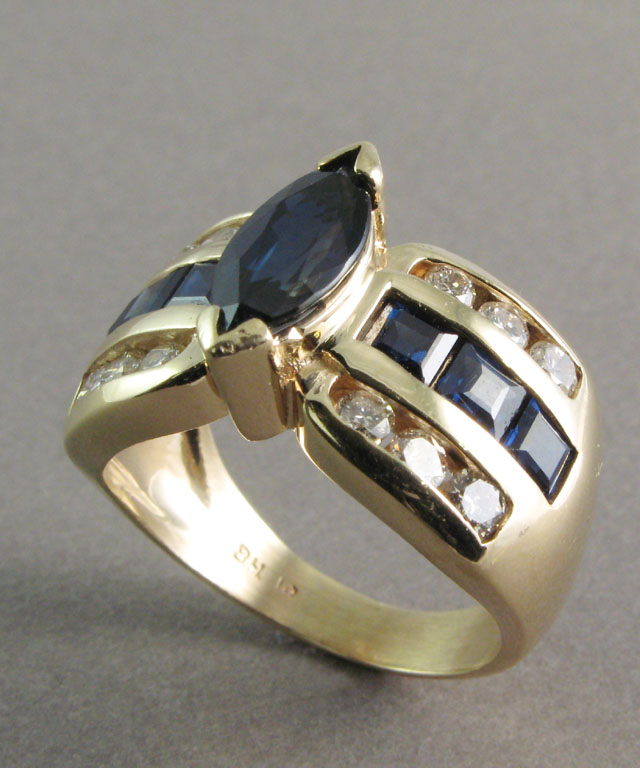 Appraisal: SAPPHIRE DIAMOND AND YELLOW GOLD RING The k gold band