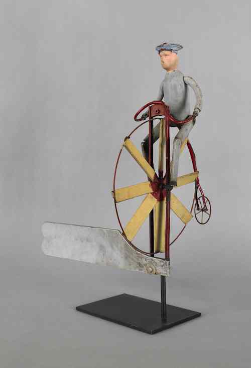 Appraisal: Painted wood metal and rubber velocipede whirligig ca h