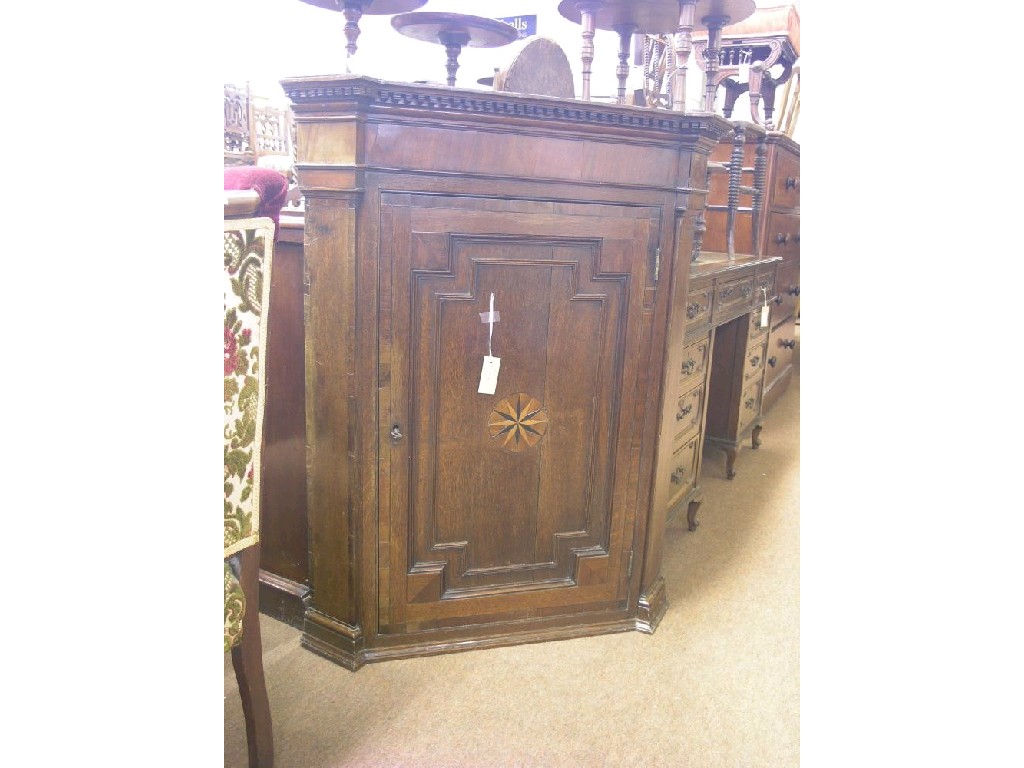 Appraisal: A George III oak corner cupboard cross-banded in mahogany throughout