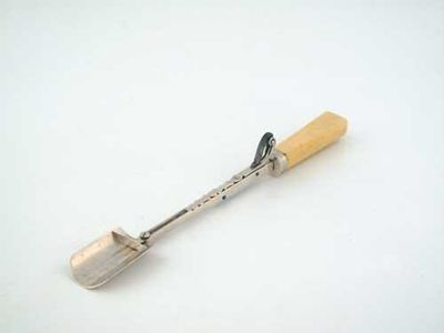 Appraisal: A George IV stilton scoop with an ivory handle reeded