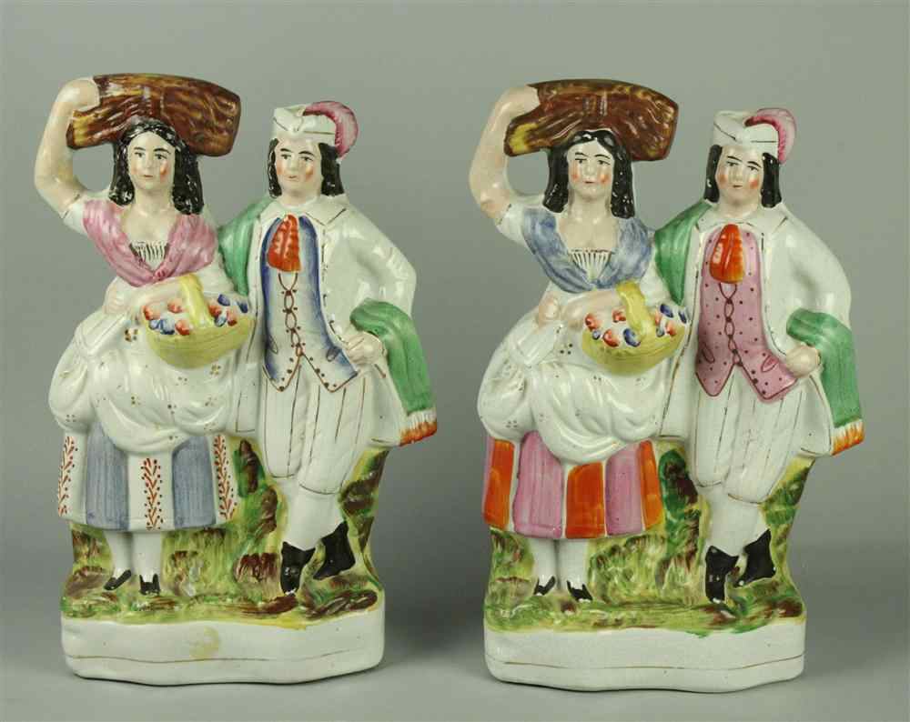 Appraisal: TWO STAFFORDSHIRE HARVESTER GROUPS each modelled as a girl holding