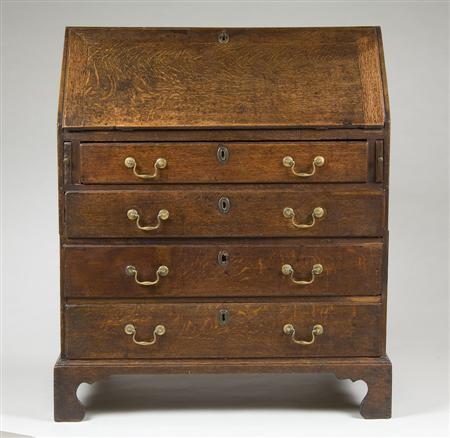 Appraisal: A George III oak bureau circa slope front and fitted