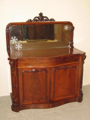 Appraisal: A VICTORIAN MAHOGANY CHIFFONIER of serpentine form the arched mirrored