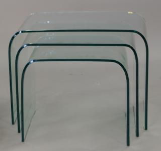 Appraisal: Curved glass nesting tables set of three largest ht wd