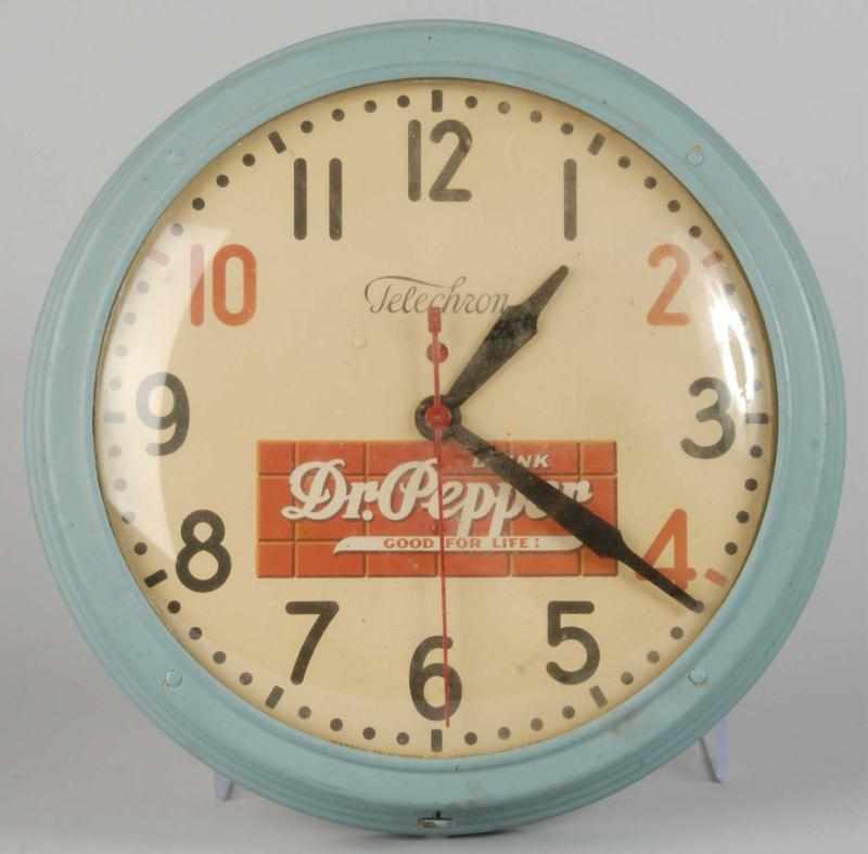 Appraisal: Dr Pepper Telechron Electric Clock Description Circa Outer case has