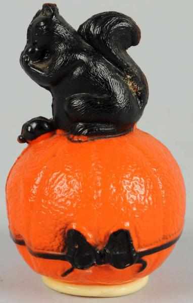 Appraisal: Celluloid Halloween Squirrel Sitting on Pumpkin Novelty item Condition Excellent