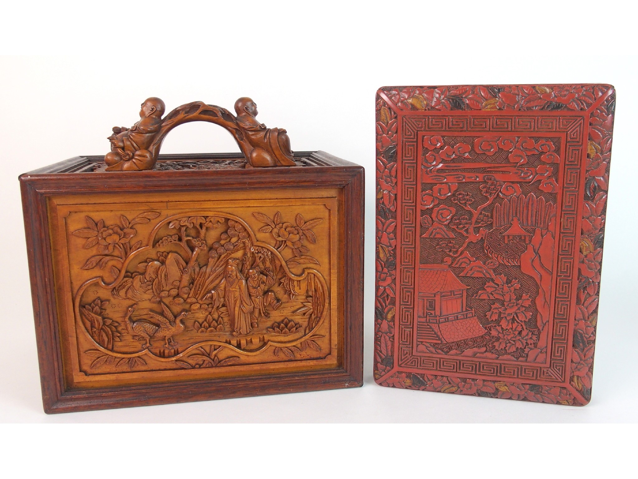 Appraisal: A Chinese carved wood games boxdecorated allover with figures in