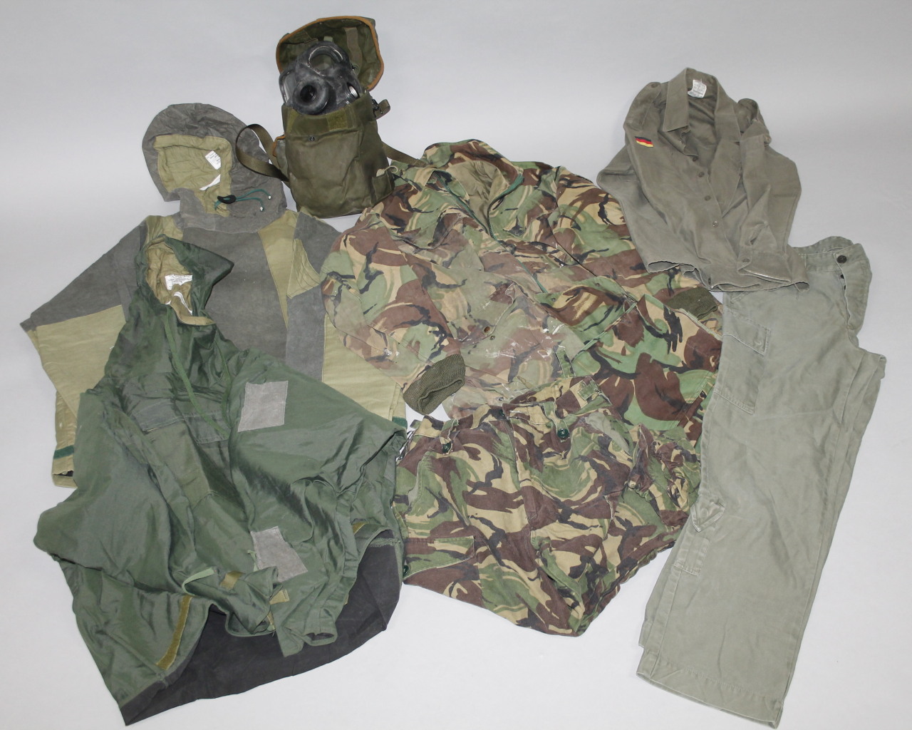 Appraisal: Various army related clothing army camouflage jacket military rucksack gas