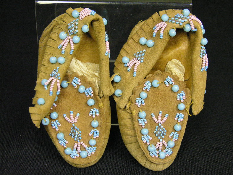 Appraisal: CHIELDS NATIVE AMERICAN MOCCASINS circa size good condition