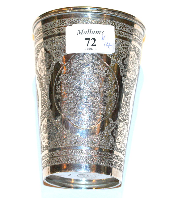 Appraisal: A PERSIAN SILVER BEAKER with chased and engraved panels depicting