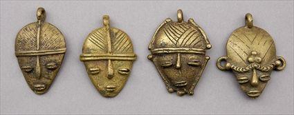 Appraisal: Four Metal African Head Pendents