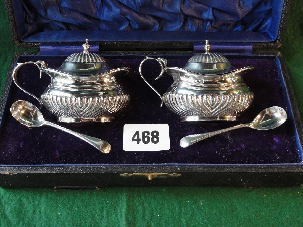 Appraisal: A boxed set of Georgian style half gadrooned salts with