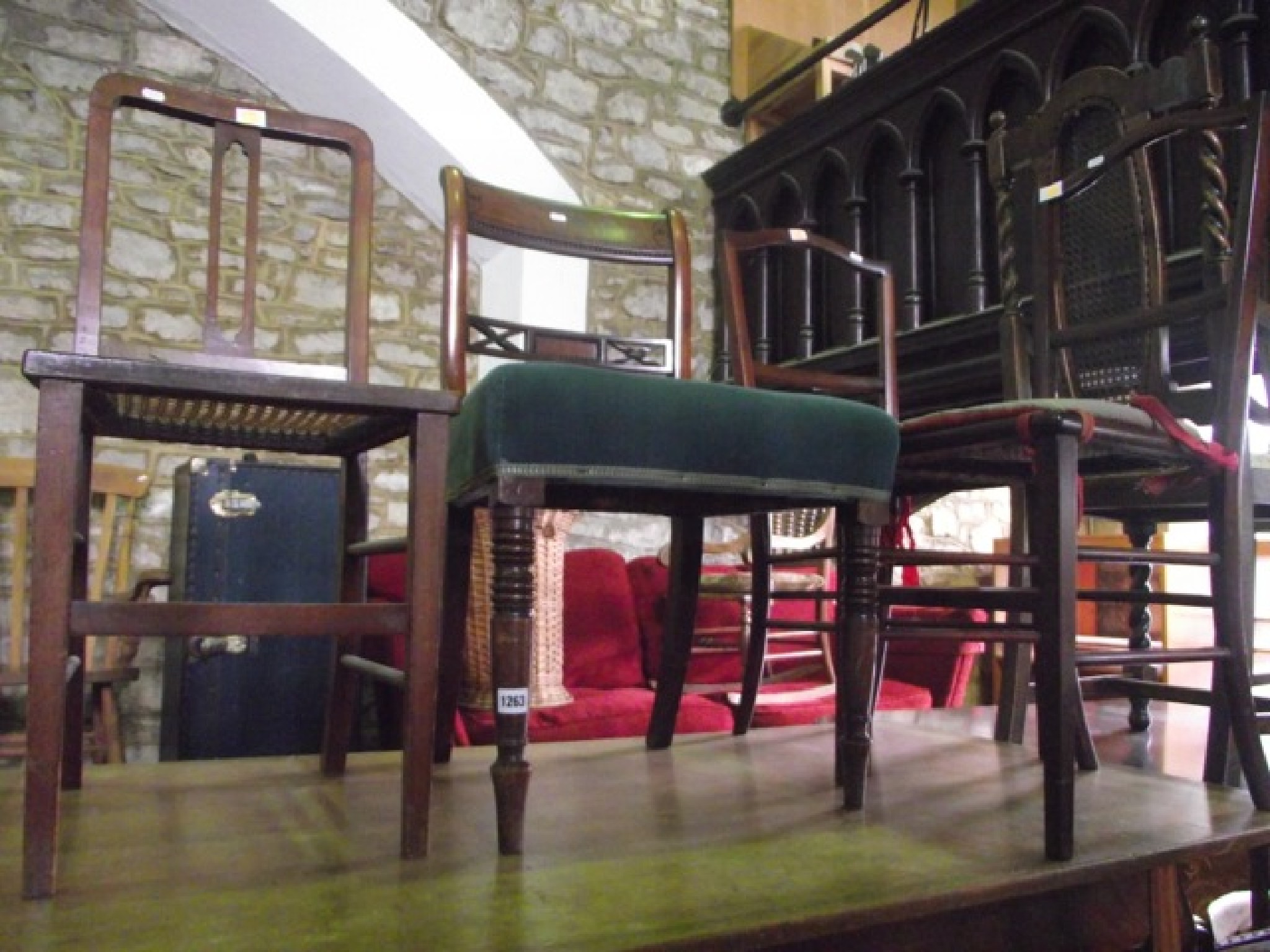 Appraisal: A Victorian walnut piano stool with circular button upholstered revolving