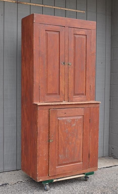 Appraisal: American Country Red Painted Cupboard with two paneled doors over