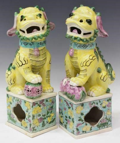 Appraisal: pair Chinese polychrome porcelain foo lions one with paw on