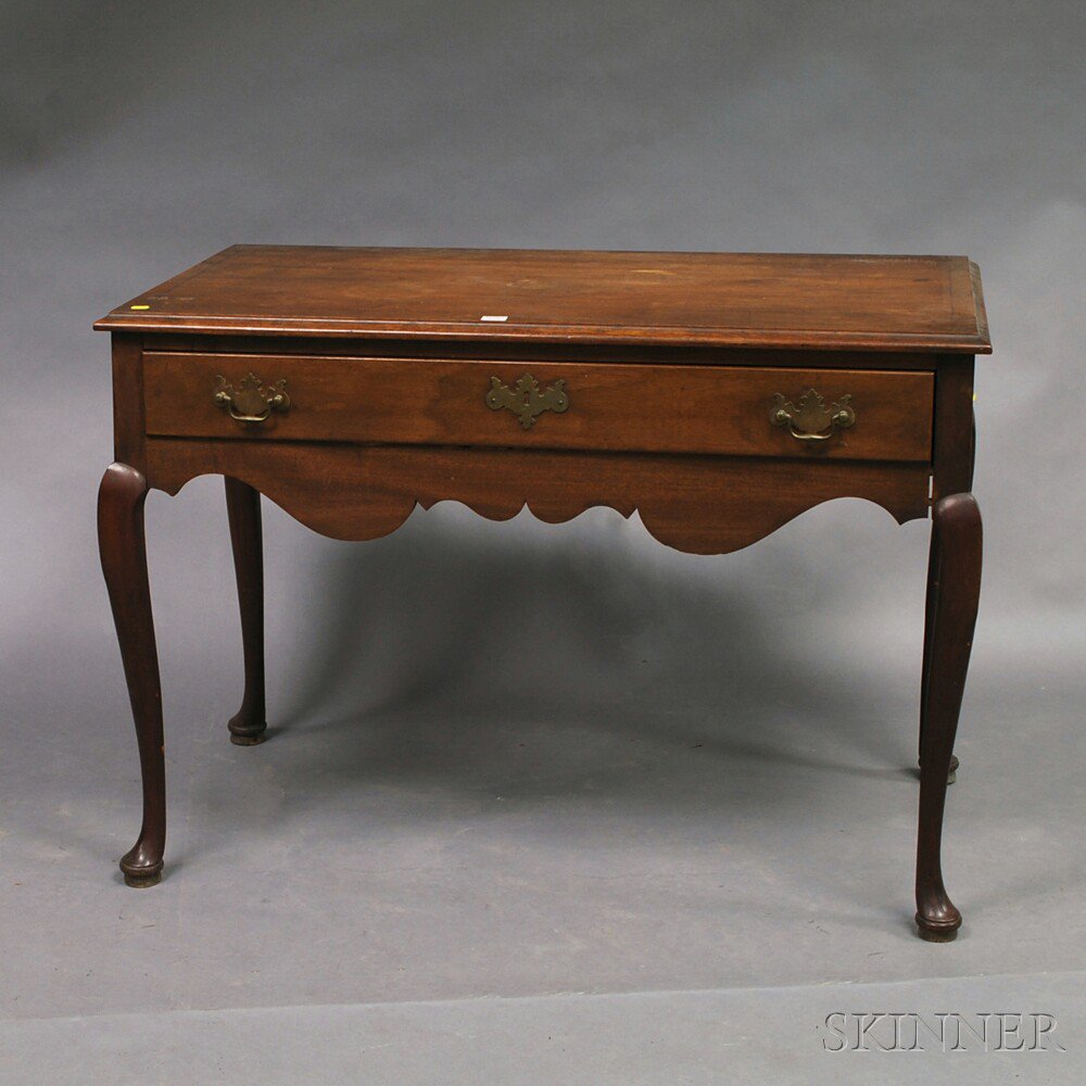 Appraisal: Queen Anne-style Walnut Dressing Table with thumbmolded top and conforming