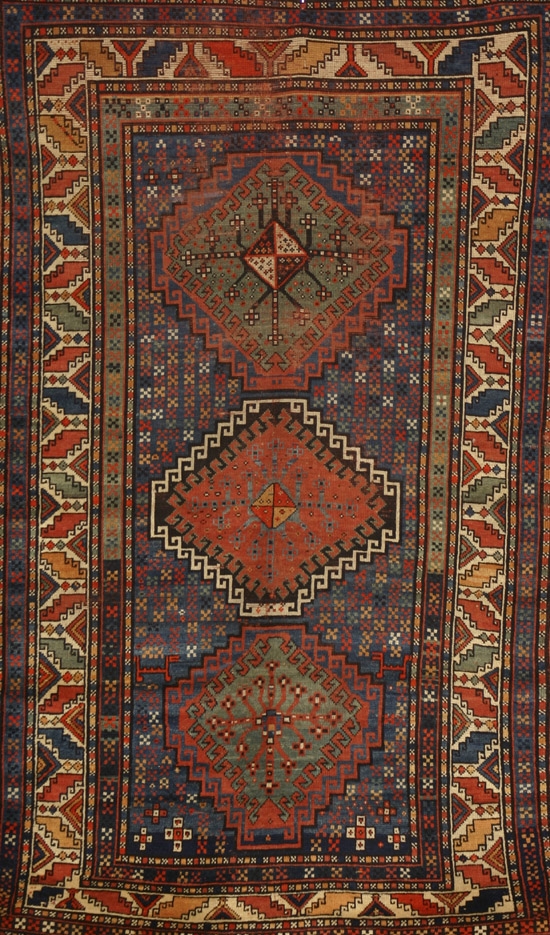 Appraisal: Gendge Rug Circa Blue ground with geometric and animal field