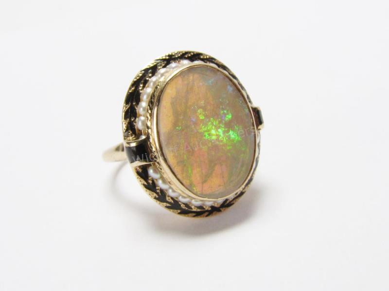 Appraisal: A K yellow gold ring with white oval opal with