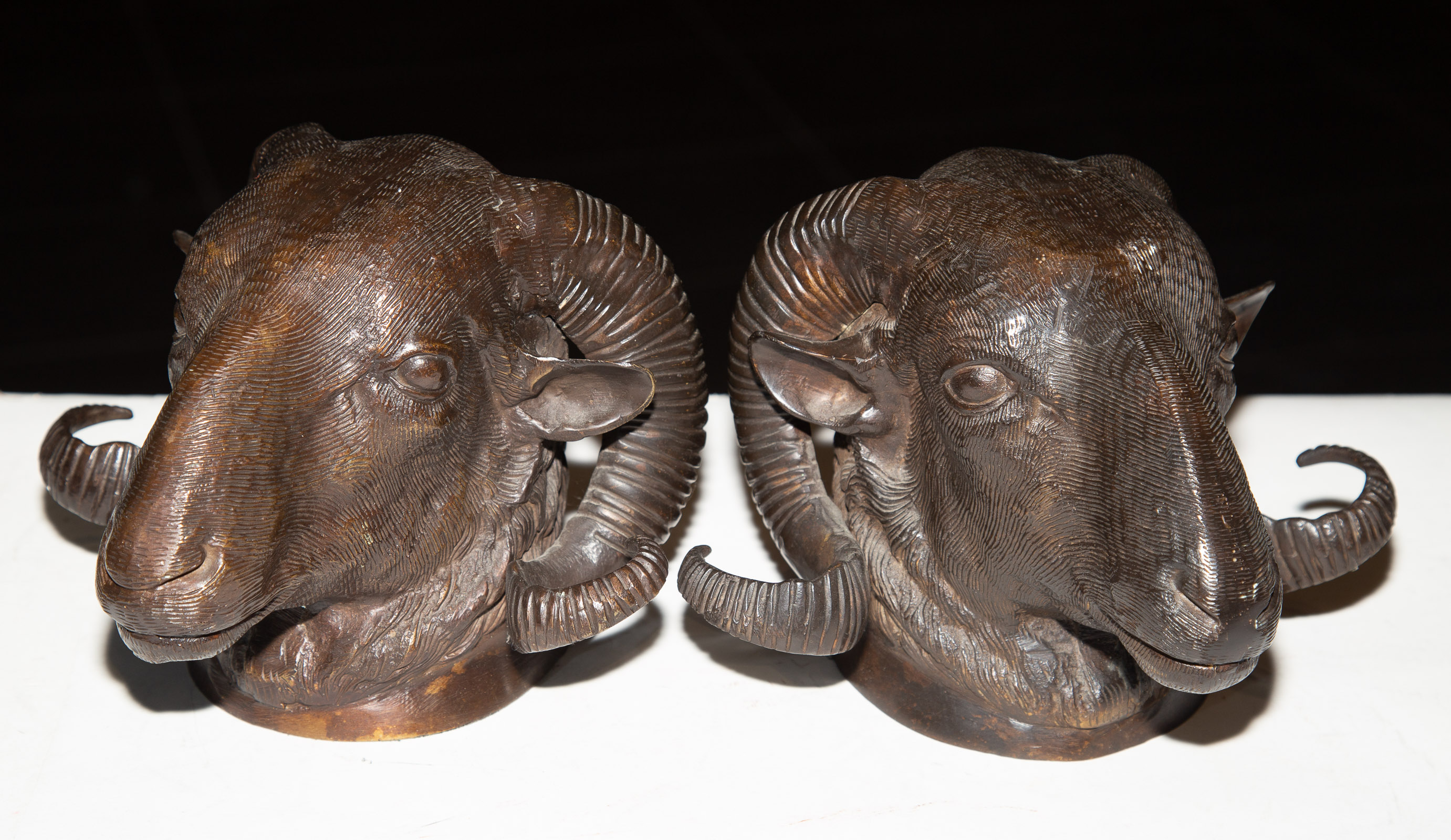 Appraisal: A PAIR OF MODERN BRONZE RAM BOOKENDS in H