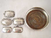 Appraisal: A silver decanter coaster London together with five silver wine