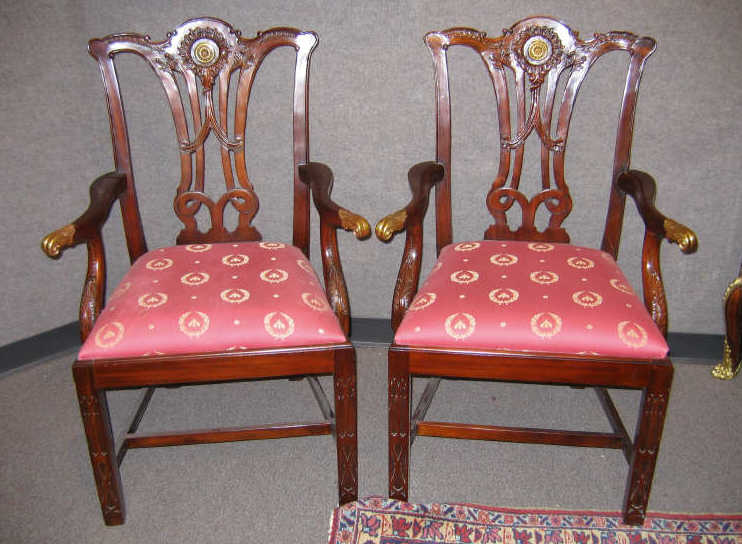 Appraisal: PAIR OF GEORGIAN STYLE MAHOGANY OPEN ARMCHAIRS Rolling top rails