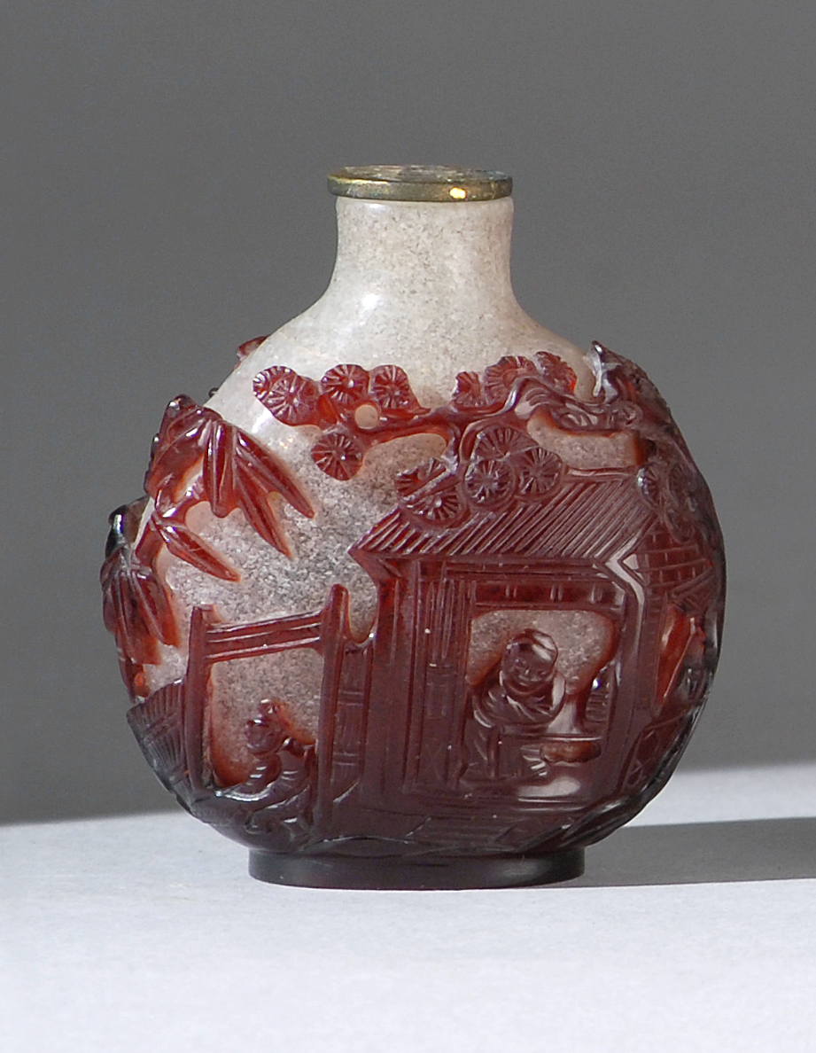 Appraisal: OVERLAY GLASS SNUFF BOTTLE In ovoid form with red landscape