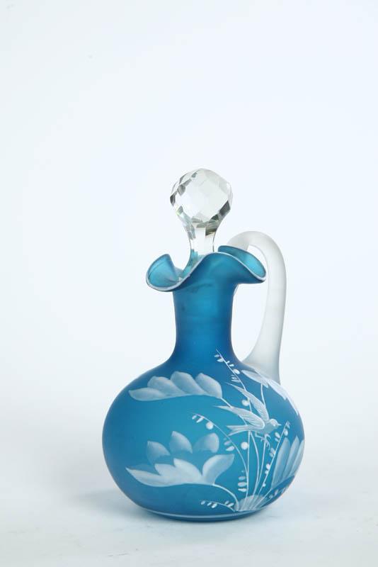 Appraisal: ART GLASS CRUET Blue with white enameled foliage and bird