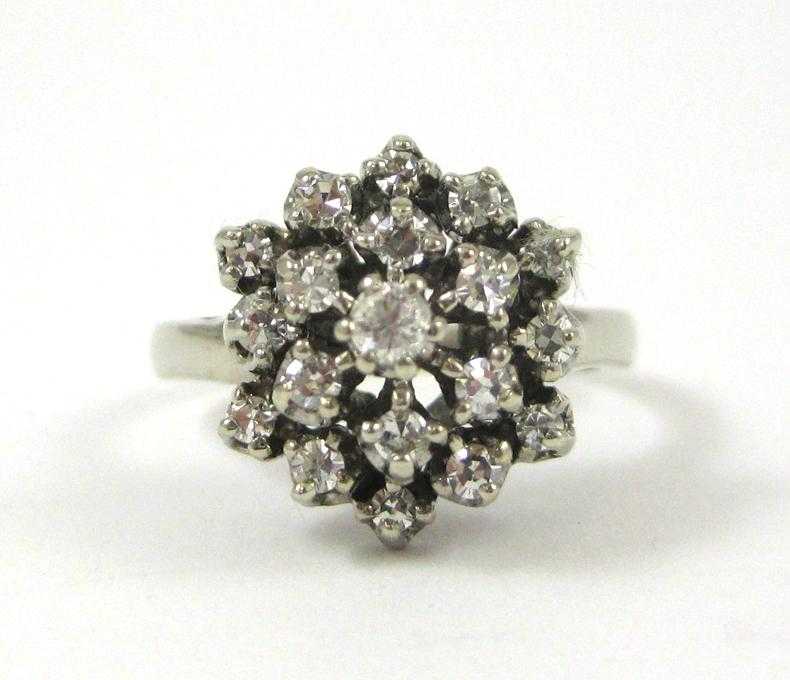 Appraisal: DIAMOND AND FOURTEEN KARAT WHITE GOLD RING set with a