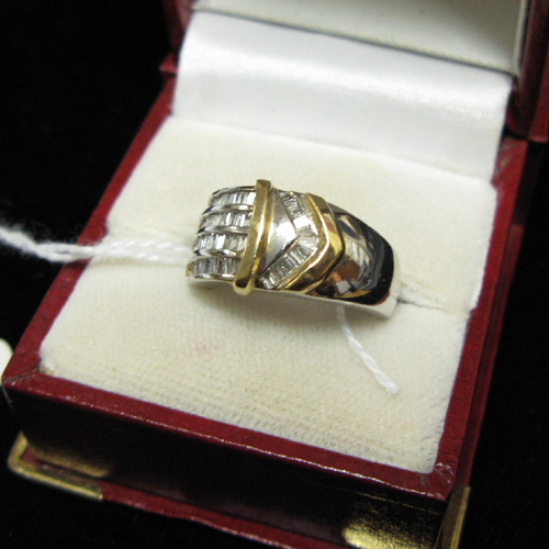 Appraisal: DIAMOND FOURTEEN KARAT WHITE AND YELLOW GOLD RING The white