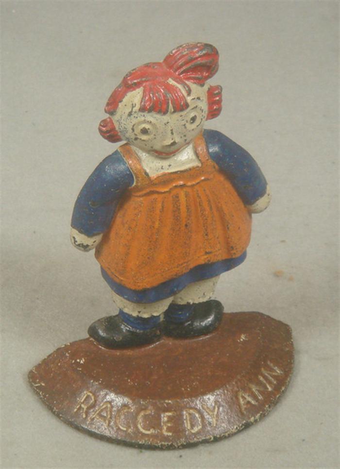 Appraisal: Cast iron bookend Raggedy Ann figure on brown engraved base