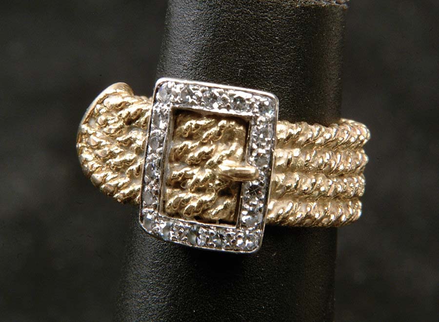 Appraisal: GOLD DIAMOND BUCKLE RING Fun little ring has textured k