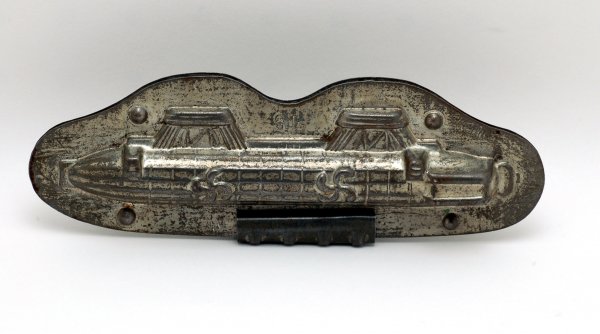 Appraisal: Tin candy mold of a zeppelin two piece with removable