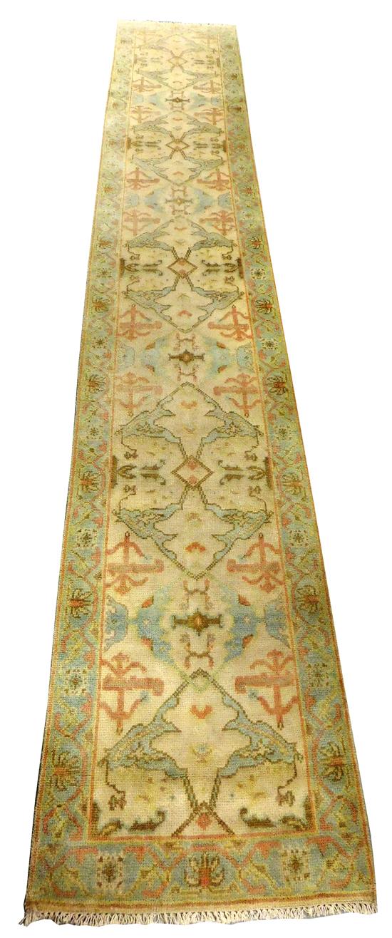 Appraisal: RUG Oushak runner cream field ensconsed in mint border mint