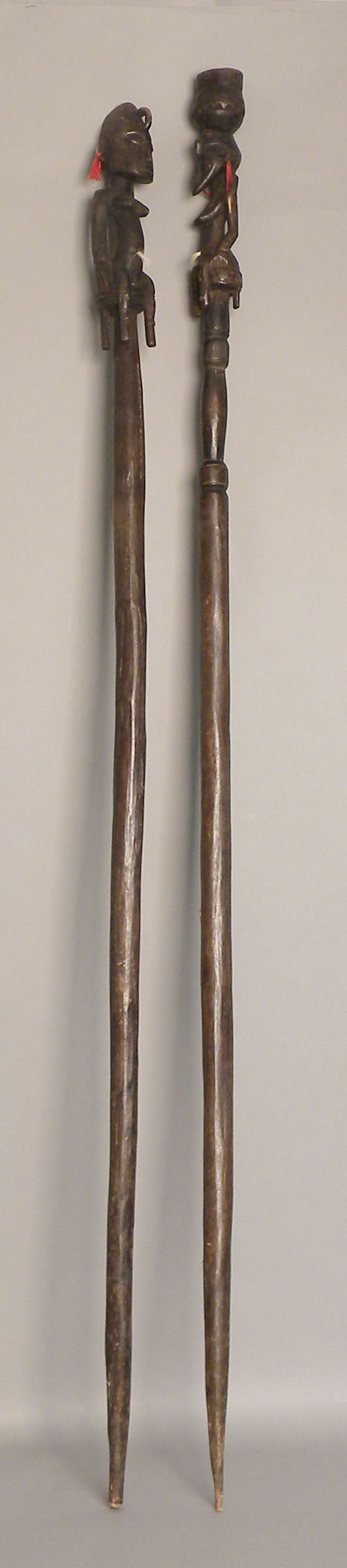 Appraisal: Two carved African staffs h and h